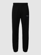 CHAMPION Sweatpants mit Label-Stitching in Black, Größe S
