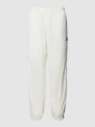 Lacoste Regular Fit Sweatpants mit Logo-Badge in Offwhite, Größe S