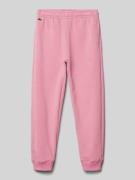 Lacoste Loose Fit Sweatpants mit Label-Badge in Pink, Größe 140