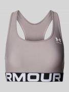 Under Armour Sport-BH mit Label-Print Modell 'Authentics' in Taupe, Gr...