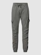 URBAN CLASSICS Jogpants mit Cargotaschen in unifarbenem Design in Dunk...