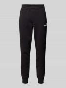 PUMA PERFORMANCE Relaxed Fit Sweatpants mit Label-Print in Black, Größ...