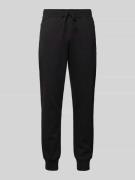 CHAMPION Relaxed Fit Sweatpants mit Reißverschlusstaschen in Black, Gr...