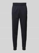 Under Armour Slim Fit Sweatpants mit Logo-Print in Black, Größe L