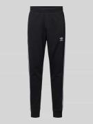 adidas Originals Sweatpants mit Label-Stitching in Black, Größe M