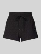 PUMA PERFORMANCE Shorts mit Logo-Muster in Black, Größe M