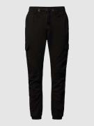 URBAN CLASSICS Jogpants mit Cargotaschen in unifarbenem Design in Blac...