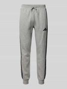 adidas Sportswear Relaxed Fit Sweatpants mit Logo-Stitching in Hellgra...