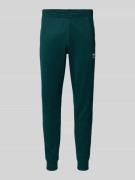 adidas Originals Slim Fit Sweatpants mit Label-Stitching in Dunkelgrue...