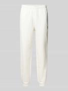 Lacoste Tapered Sweatpants aus reiner Baumwolle in Offwhite, Größe L