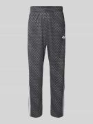 adidas Originals Trainingshose mit Logo-Muster in Black, Größe L