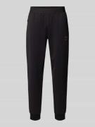 EA7 Emporio Armani Sweatpants mit elastischem Bund und Label-Patch in ...