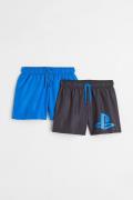 H&M 2er-Pack Badeshorts mit Print Knallblau/PlayStation in Größe 98/10...