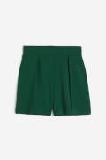 H&M Shorts mit Bundfalten Dunkelgrün in Größe XS. Farbe: Dark green