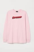 H&M Jerseyshirt mit Druck Hellrosa/Superbad, Tops in Größe S. Farbe: L...