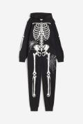 H&M Sweatoverall mit Print Schwarz/Skelett, Jumpsuits in Größe 170. Fa...